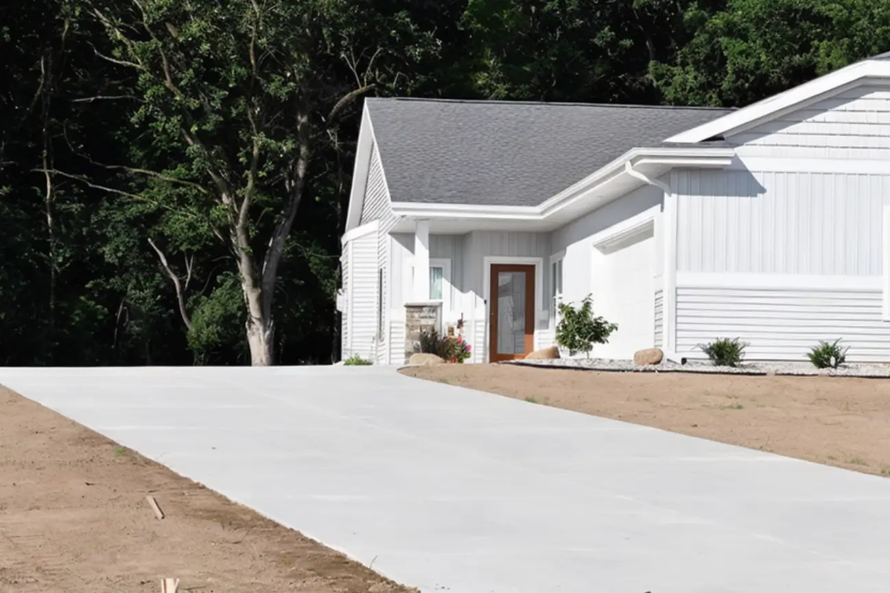 Newly poured residential concrete driveway project completed by RHL Build HB Concrete